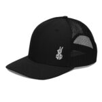 Black trucker hat with the paddle hands logo on the bottom left corner. Side profile.